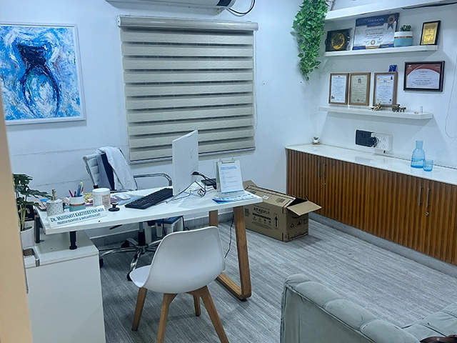 Receive expert dental consultation in a well-furnished room for patient comfort and care in Alwarpet